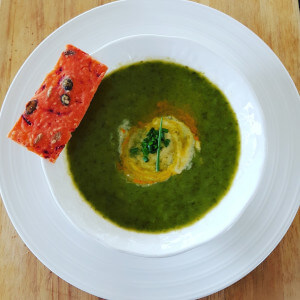 Wild garlic soup with beetroot and pumpkin seed cracker.